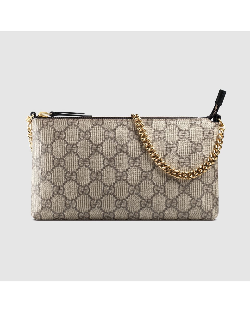 Gucci discount supreme wristlet